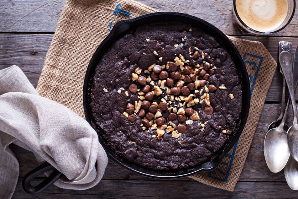 A cast iron double chocolate brookie fresh out of the oven and ready to be devoured.