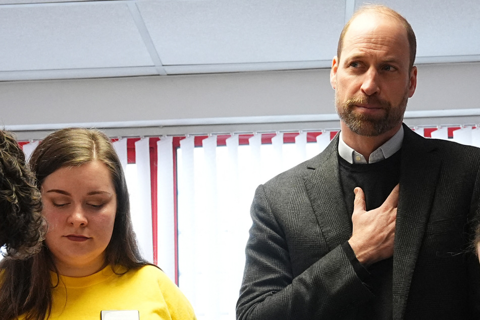 During a recent charity visit, Prince William (r.) opened up about his personal experiences with grief, including the death of his mother, Princess Diana.