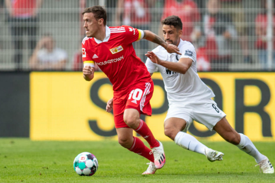 Max Kruse (32, l.) im Zweikampf mit Augsburgs Rani Khedira (26). Mit Neuzugang Loris Karius (27) soll der Angreifer der Eisernen eine sportliche K&K-Dynastie begründen.