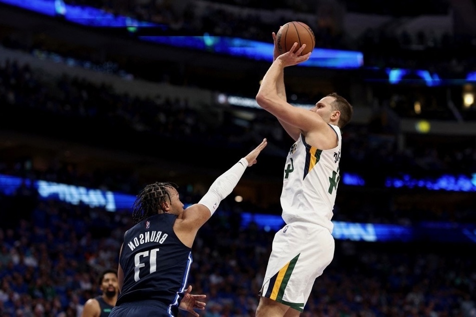 Bojan Bogdanovic of the Utah Jazz shoots the ball against Jalen Brunson of the Dallas Mavericks in the fourth quarter at American Airlines Center.