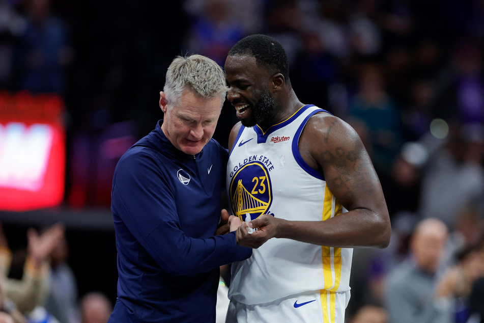 Golden State Warriors coach Steve Kerr (l.) accepted the NBA's decision to issue forward Draymond Green with an indefinite suspension.