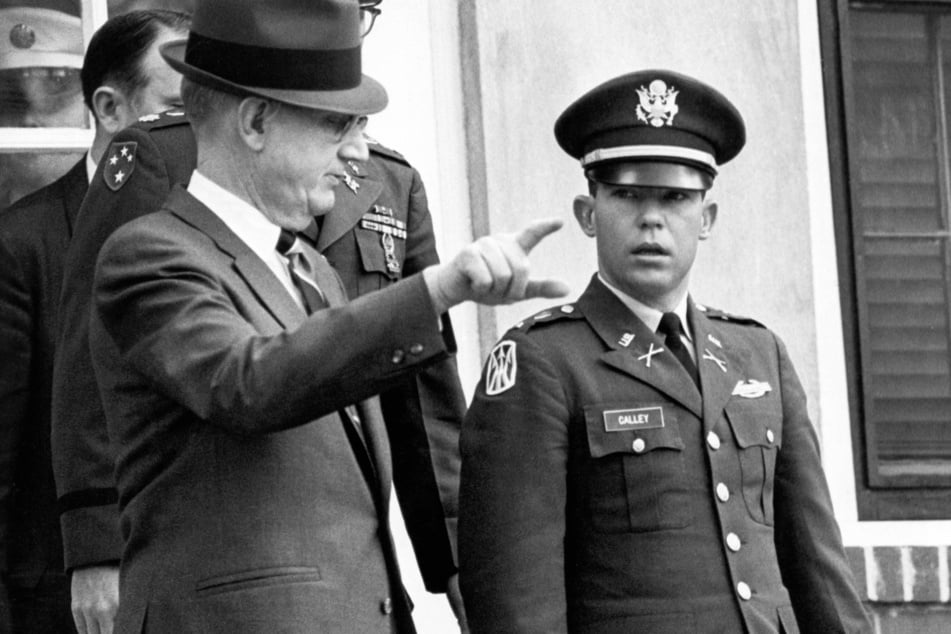 Civilian attorney George Latimer (l.) gestures as he escorts his client, Army Lt. William C. Calley, after a pre-trial hearing in a forthcoming court martial.