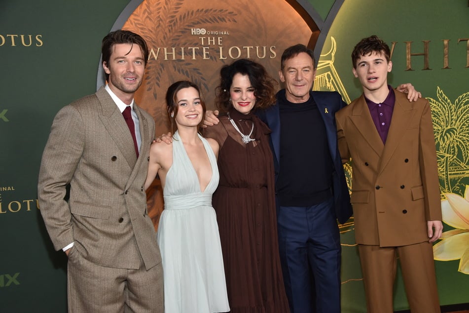 (L-R) Actors Patrick Schwarzenegger, Sarah Catherine Hook, Parker Posey, Jason Isaacs, and Sam Nivola attend the season three premiere of HBO's The White Lotus at Paramount Studios in Los Angeles on Monday.