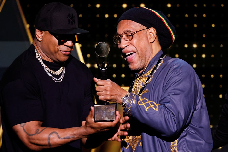 DJ Kool Herc receives the Musical Influence Award from LL Cool J during the 38th Annual Rock &amp; Roll Hall of Fame Induction Ceremony.
