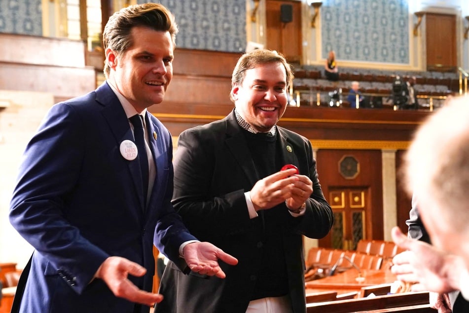 Matt Gaetz (l.) talks with George Santos (r.) ahead of the State of the Union address by President Joe Biden at the Capital building in Washington DC on March 7, 2024.