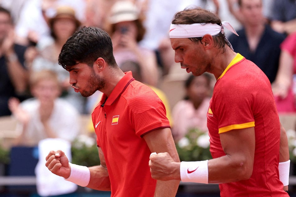 Carlos Alcaraz (l.) and Rafael Nadal of Spain are competing together in men's doubles tennis at the Paris Olympics.