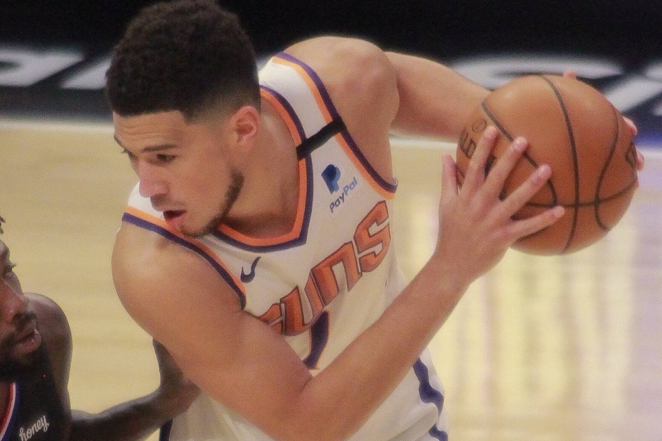 Suns guard Devin Booker led Phoenix with 28 points in their game three win on Friday night