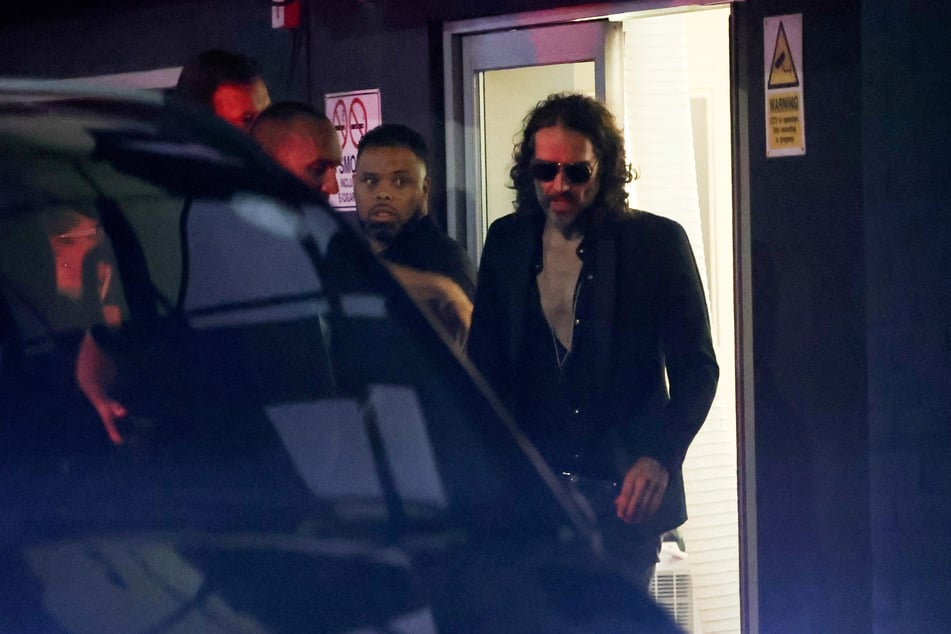 Russell Brand walks outside the Wembley Park Theatre in northwest London, UK, on September 16, 2023.