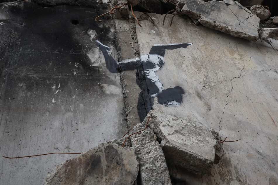 Street artist Banksy posted a photo of art in Borodianka, Ukraine, presumably claiming the work as his own.