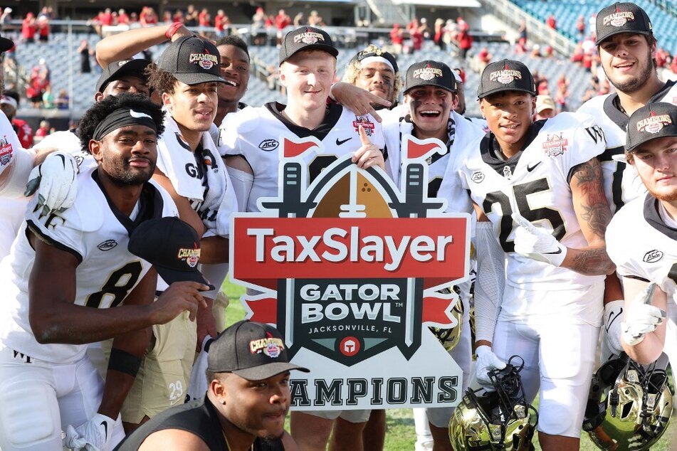 The Wake Forest Demon Deacons celebrated a 38-10 victory against the Rutgers Scarlet Knights in the TaxSlayer Gator Bowl.