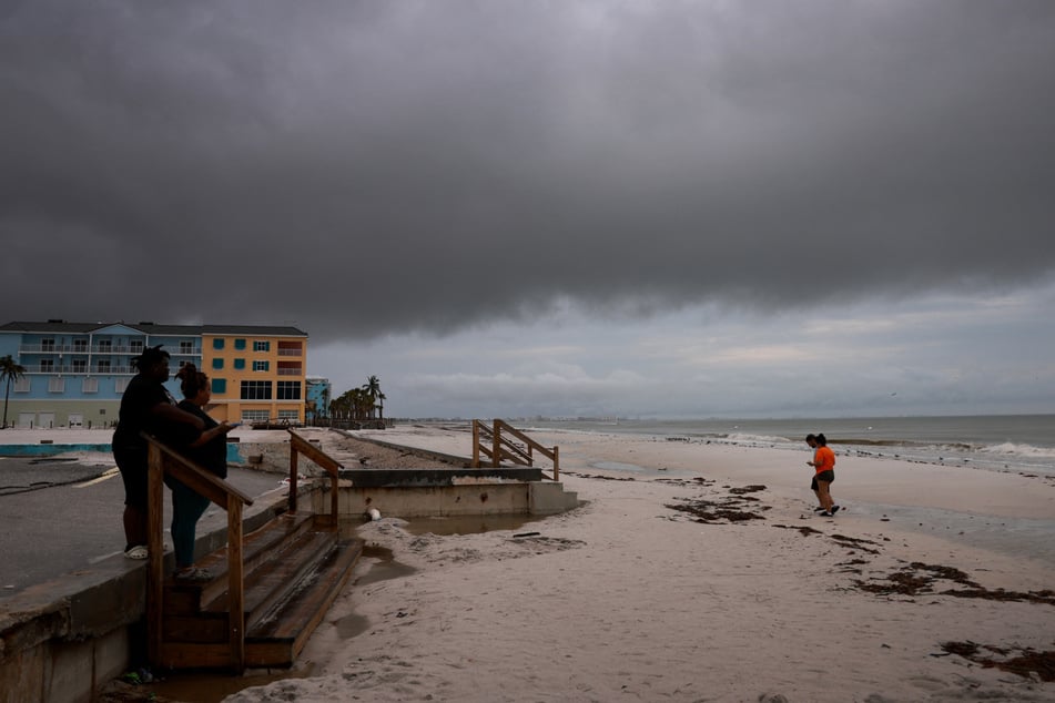 Storm-battered Florida braced for a direct hit from Hurricane Milton, which strengthened back to a Category 5 storm Tuesday.