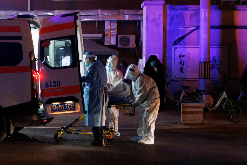 An ambulance picks up a patient in Beijing, China, where Covid cases are on the rise.