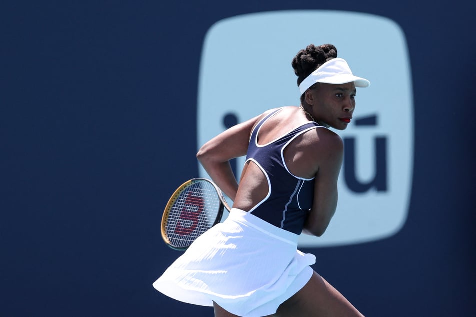 Venus Williams of the US returns a shot from Diana Shnaider of Russia during her women's singles match during the Miami Open at Hard Rock Stadium on March 19, 2024.