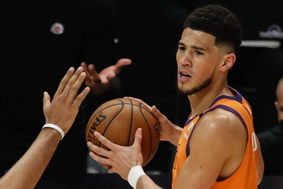 Suns guard Devin Booker missed Friday night's game against the Warriors with a hamstring injury he suffered on Tuesday night.