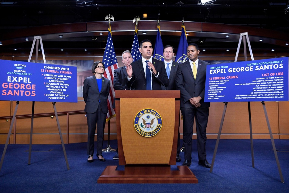 Congressman Robert Garcia of California (c.), joined by other House members, discussed a proposed resolution to expel George Santos from Congress during a news conference.