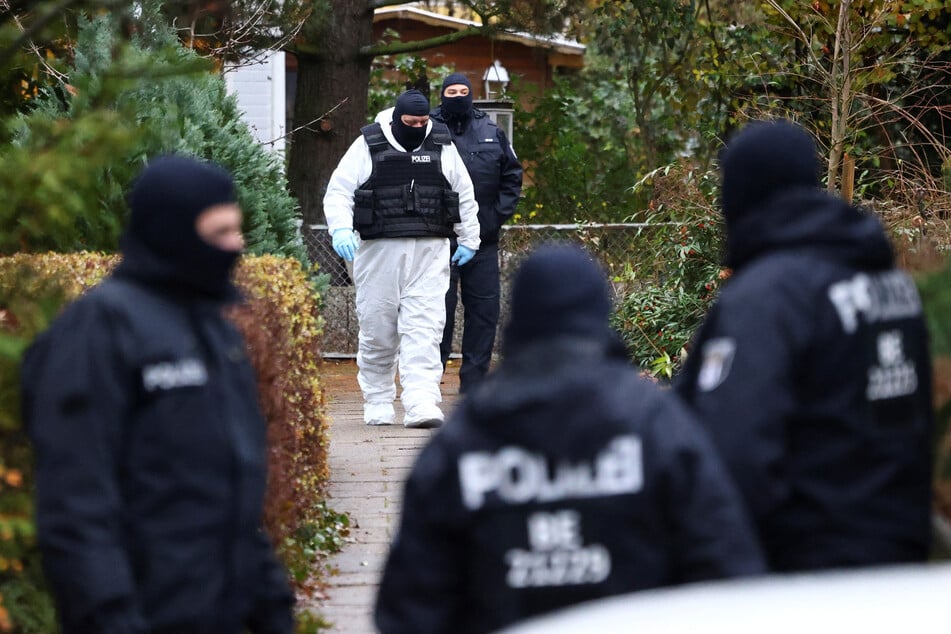 German police secure the location of one of the raids conducted in Berlin.