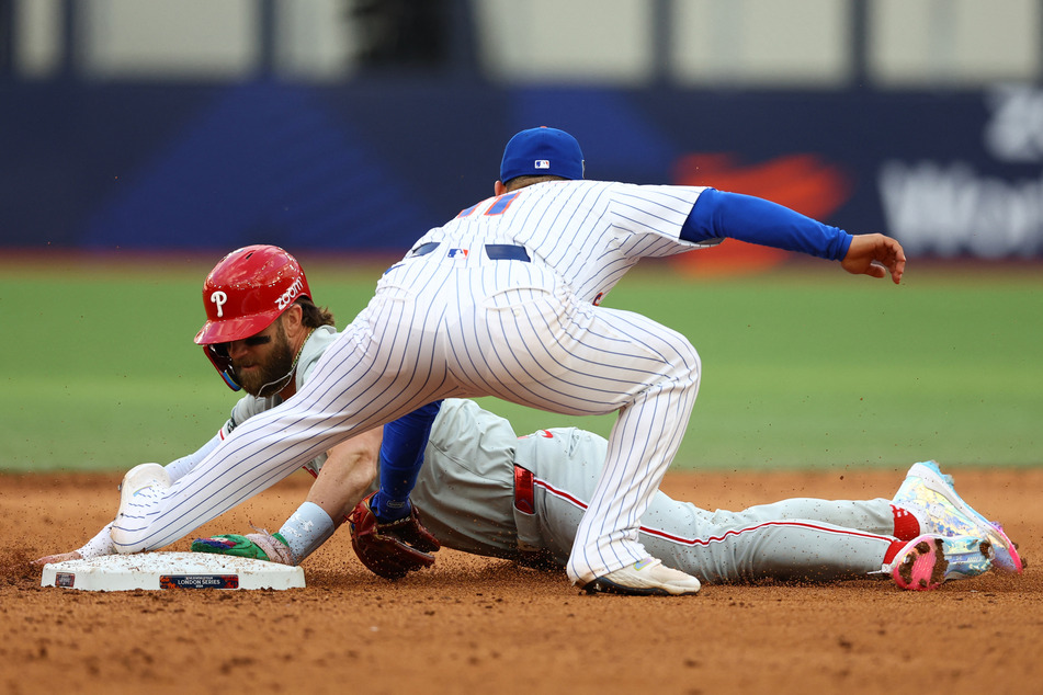 The Philadelphia Phillies' Bryce Harper in action with the New York Mets' Jose Iglesias.