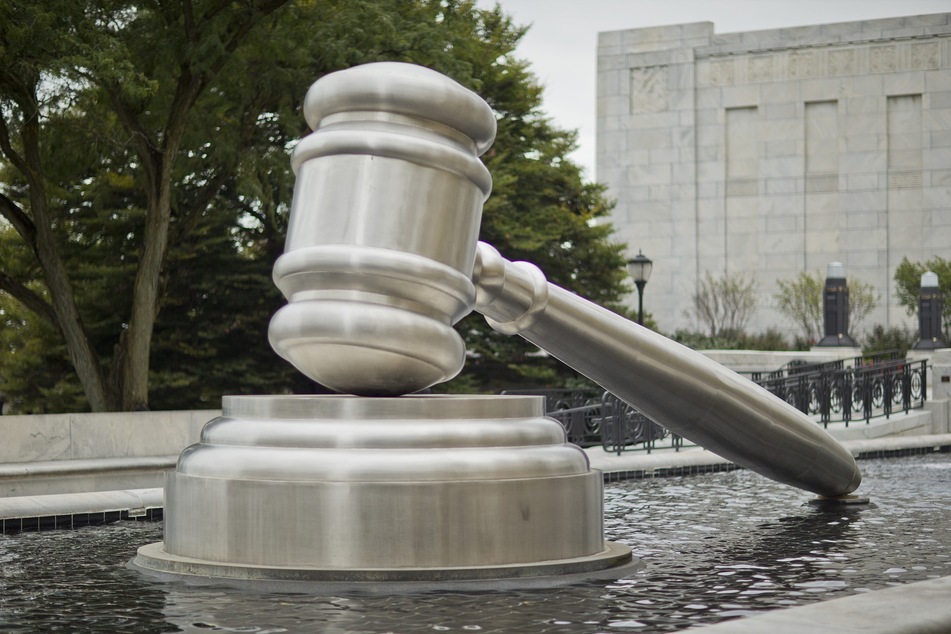 A sculpture of the world's largest gavel sits in the south reflecting pool outside the Supreme Court of Ohio.