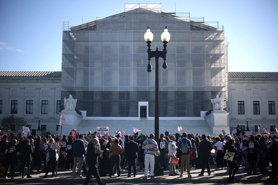 Activists gather during a rally in front of the US Supreme Court on Wednesday in Washington, DC.
