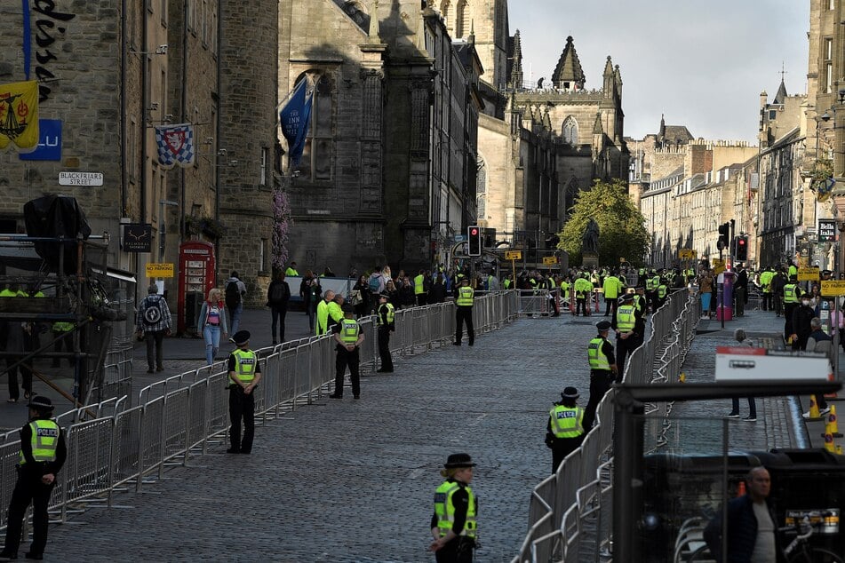 Police officers were part of increased security on duty on the Royal Mile in Edinburgh on Monday, as mourners waited to pay their respects at the coffin of Queen Elizabeth II.