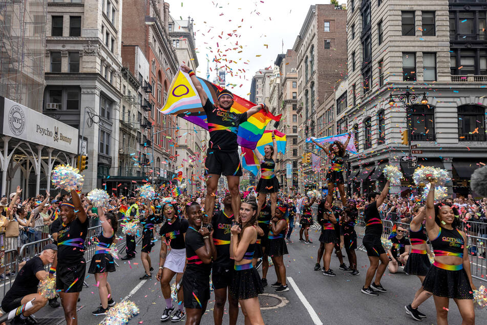 New Yorkers celebrate during the annual Pride March into the West Village on June 30, 2024, in New York City.