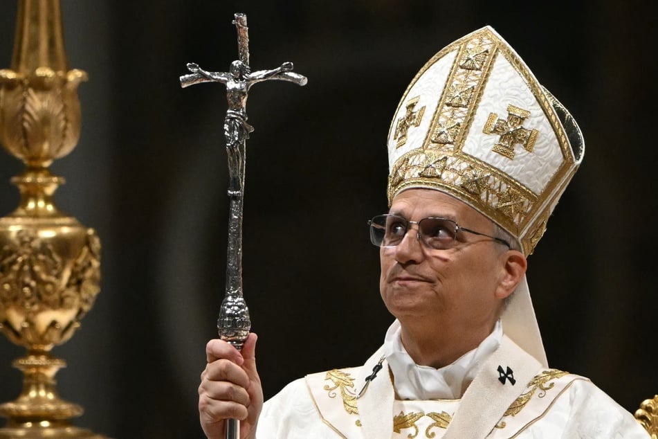 Pope Leo XIV presides over the Easter vigil as part of the Holy Week celebrations at St Peter's basilica in the Vatican on April 4, 2026.