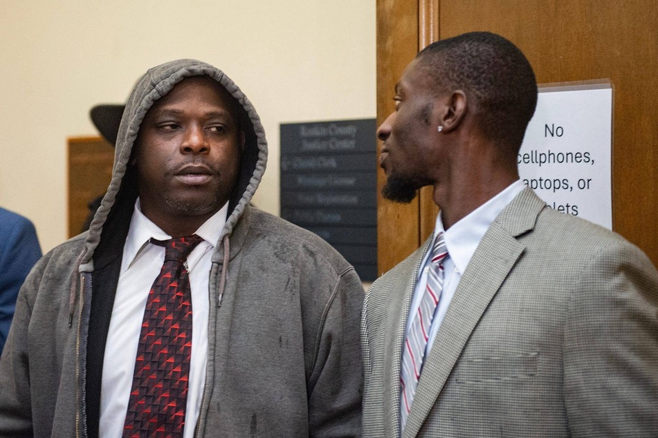 Eddie Parker and Michael Jenkins talk after the sentencing at the Rankin County Circuit Court in Brandon, Mississippi.