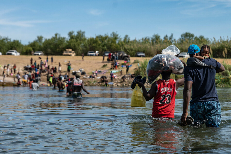 Migrants cross back and forth from Mexico to the US near Del Rio, Texas.