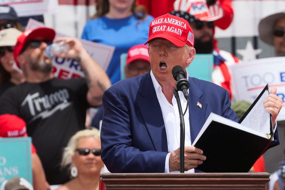 Trump courts service voters with tax vow and bashes Biden at scorching Vegas rally