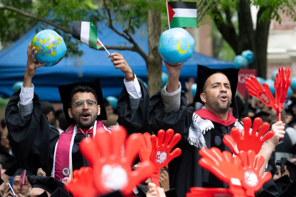 Harvard students graduate as Trump's threats loom large over celebration