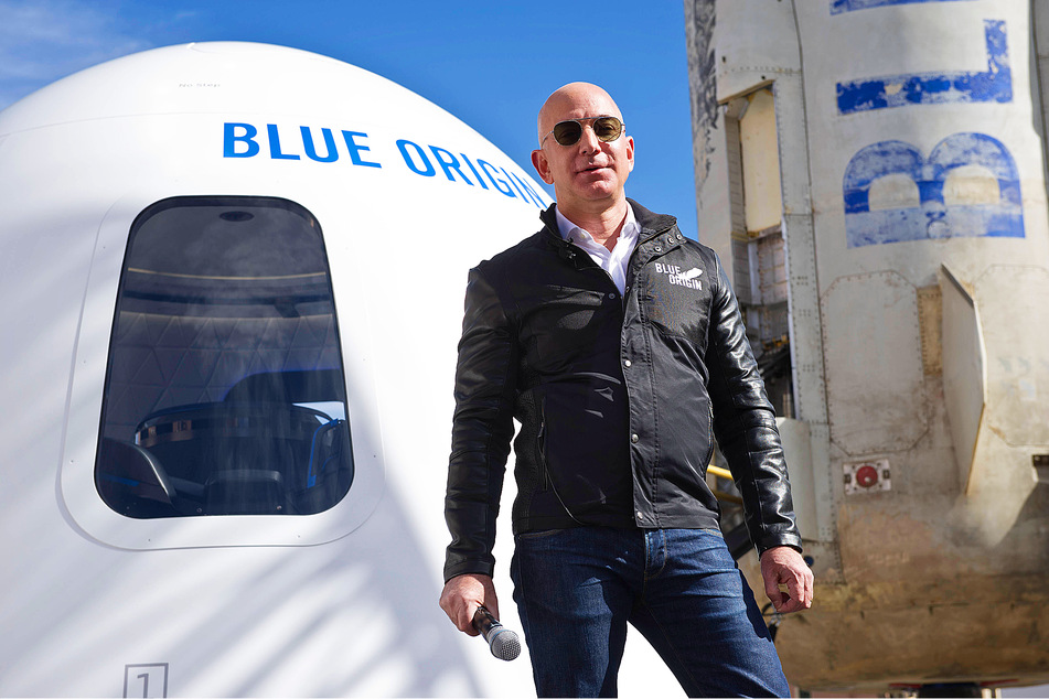 Jeff Bezos in front of his company Blue Origin's New Shepard rocket. On July 20, he and a crew of civilians went on a suborbital flight. Just to be clear, that didn't count as getting to space.