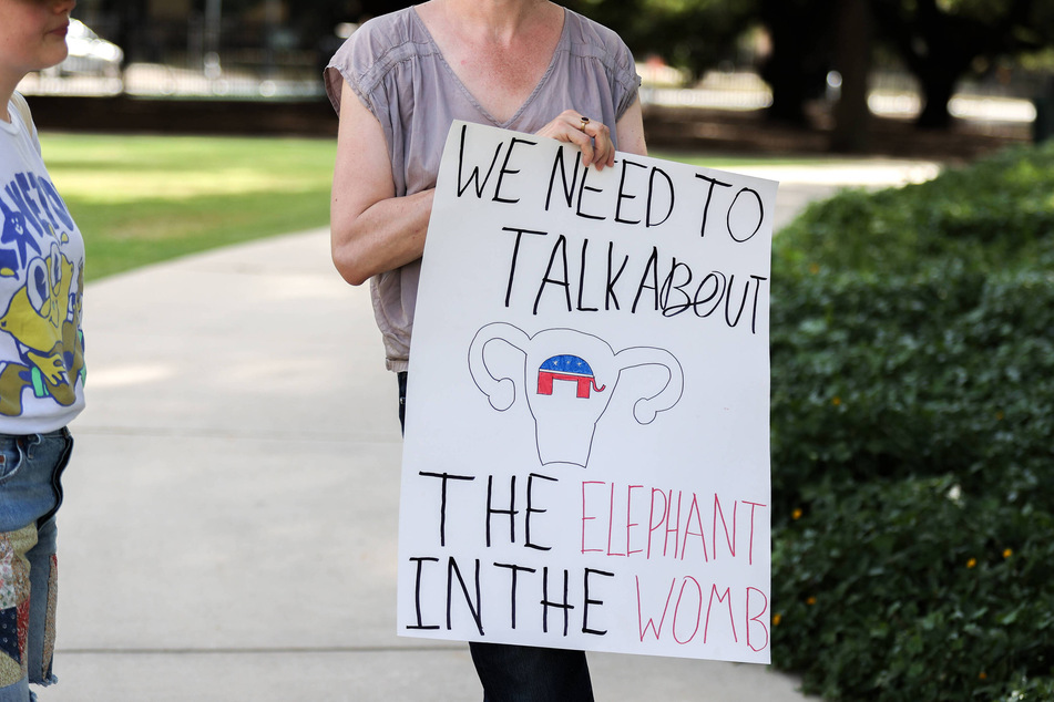 Abortions fell in states with bans and restrictions, like in Texas. A pro-choice protester at a demonstration in Houston, Texas in July 2023.