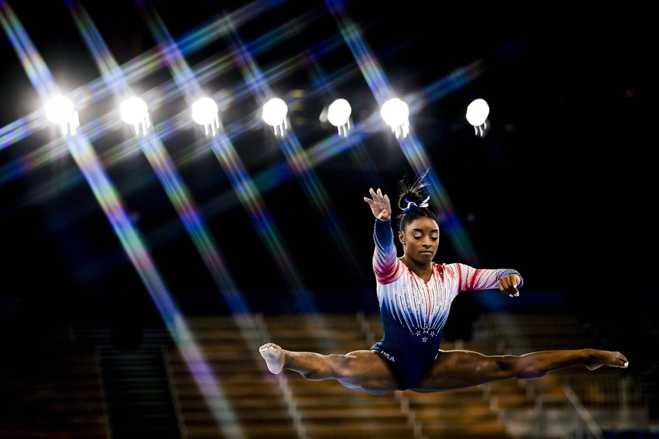 Simone Biles competes during the balance beam final in Tokyo.