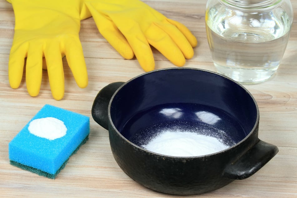 Make sure to wear gloves when cleaning a burnt pot.