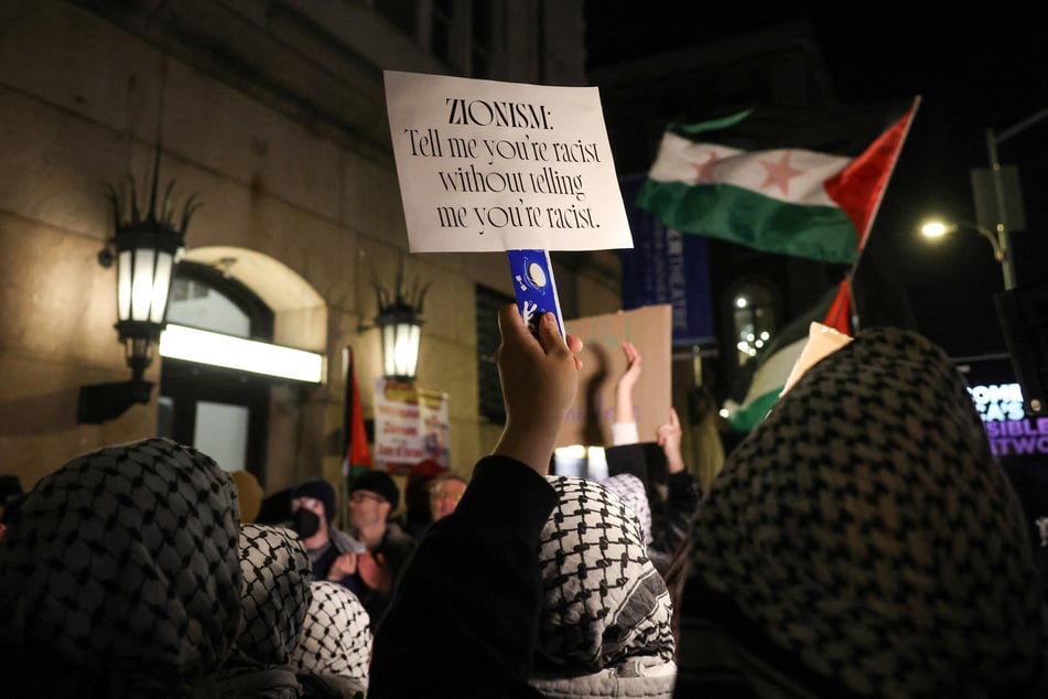 Demonstrators protest outside the main gates of Columbia University as the university prepares to host former Israeli PM Naftali Bennett on March 4, 2025.