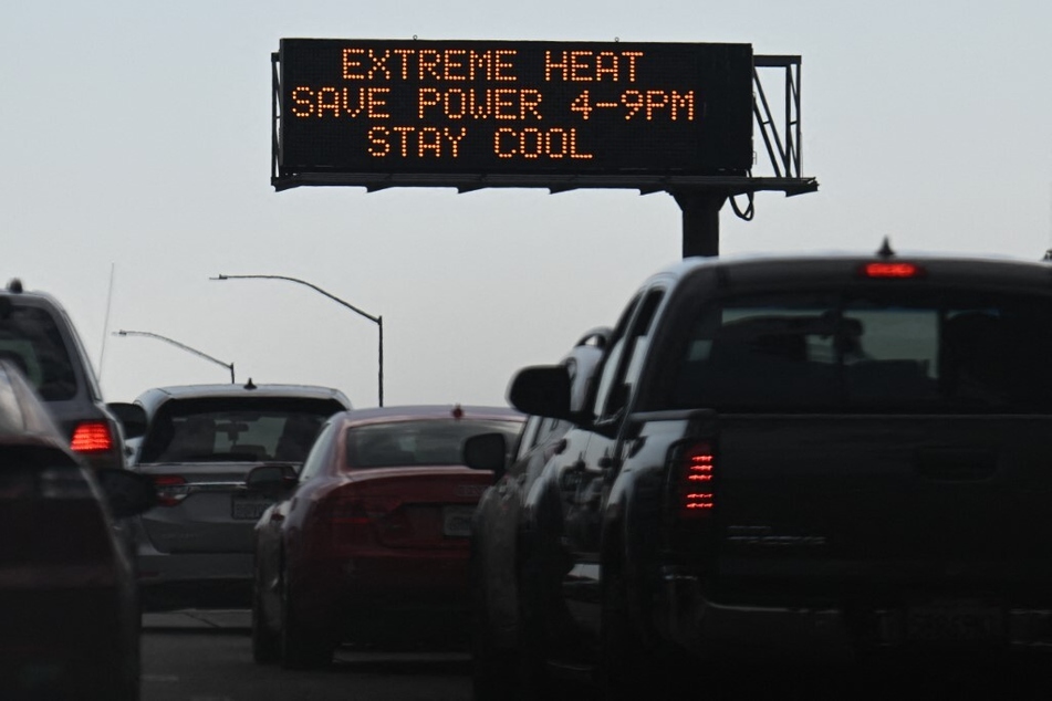 A sign on the 110 Freeway warning of extreme heat during a heat wave in downtown Los Angeles, California on September 2, 2022.
