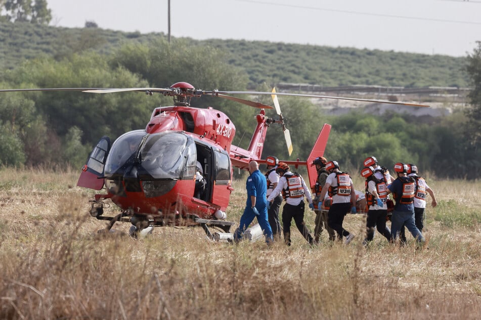 Israeli rescue teams evacuate a wounded person by helicopter near the southern city of Sderot on October 7, 2023, after the Palestinian militant group Hamas launched a large-scale surprise attack on Israel.