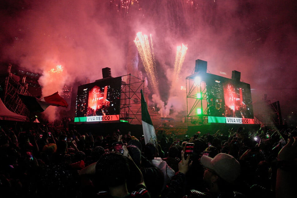 Mexico supporters celebrate as fireworks light up the sky after the team won their World Cup Round of 32 match against Ecuador on June 30, 2026.