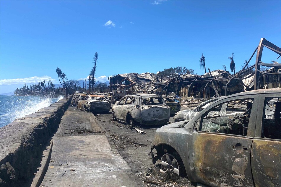 Burned cars and destroyed buildings are pictured in the aftermath of the wildfire in Lahaina, western Maui, Hawaii.