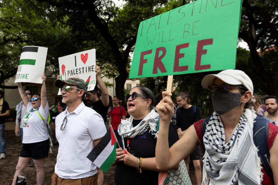 Professors and students chant during a pro-Palestine protest at the University of Texas at Austin.