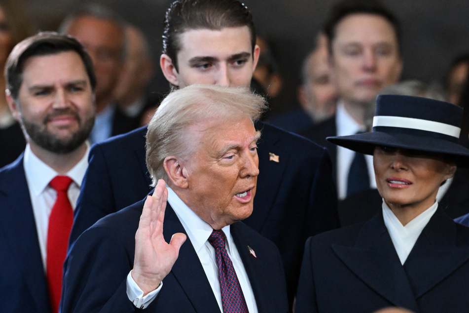 With one hand raised in the air and the other on a Bible given to him by his mother, Donald Trump solemnly took the oath of office beneath the huge Rotunda of the US Capitol.