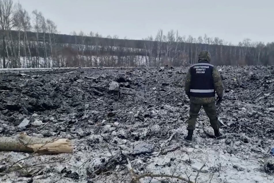 A view shows the crash site of the Russian Ilyushin Il-76 military transport plane near the village of Yablonovo in the Belgorod region, Russia, in this still image from video published January 25