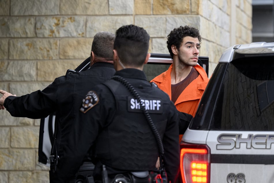 Luigi Mangione is led into the Blair County Courthouse for an extradition hearing Tuesday in Hollidaysburg, Pennsylvania.