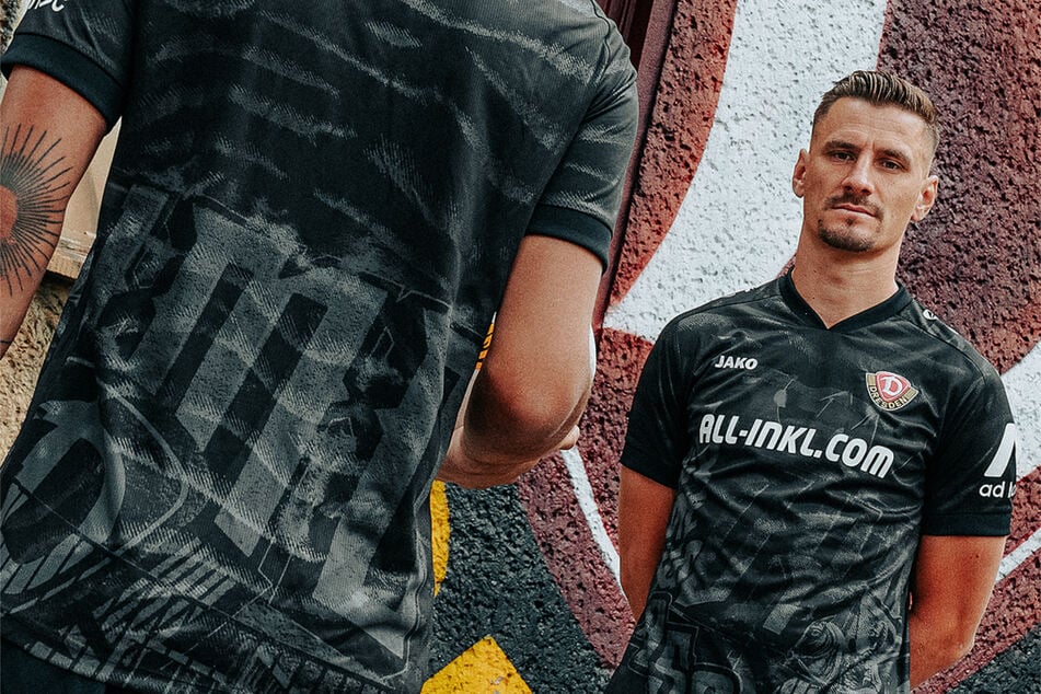 Die Local Heros Tim Schreiber (Rücken) und Stefan Kutschke präsentieren das dritte Trikot, das die Dresdner Stadtkultur aufgreift.