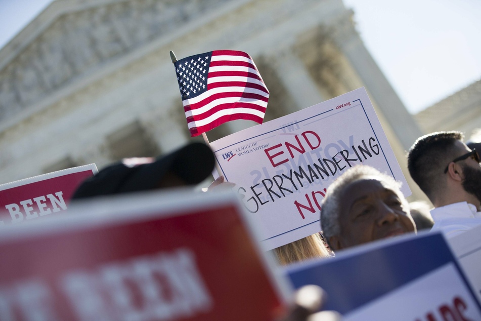 Protesters demand an end to partisan gerrymandering outside the US Supreme Court.