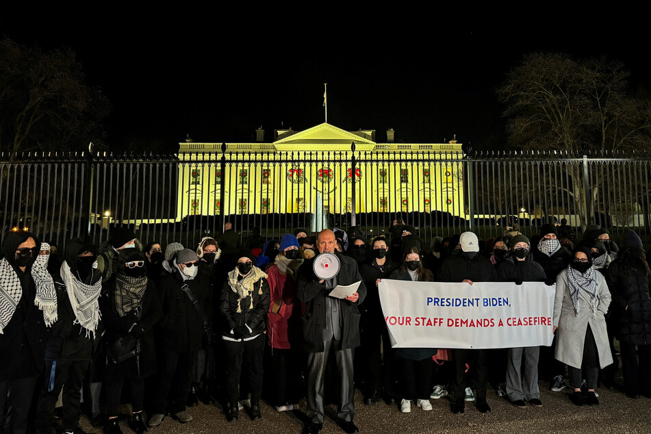 Biden administration staffers hold a vigil outside the White House to call for a permanent ceasefire in Gaza.