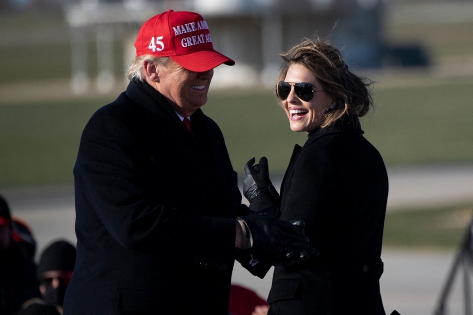 Hope Hicks smiles at Donald Trump during a Make America Great Again rally at Iowa's Dubuque Regional Airport on November 1, 2020.