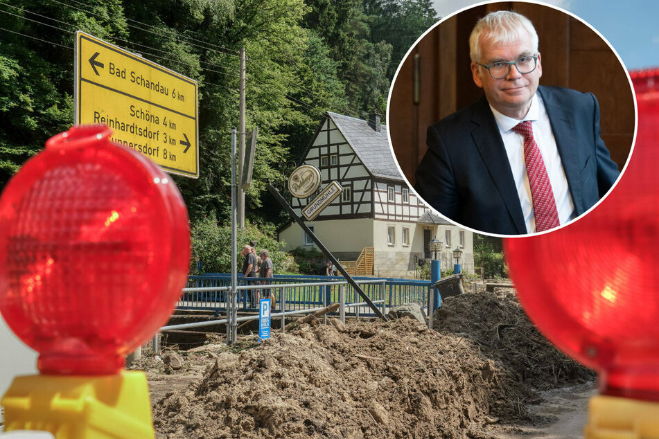 Finanzminister Hartmut Vorjohann (58, CDU, r.) hat per Erlass verfügt, dass vom Hochwasser Betroffene Steuererleichterungen bekommen.