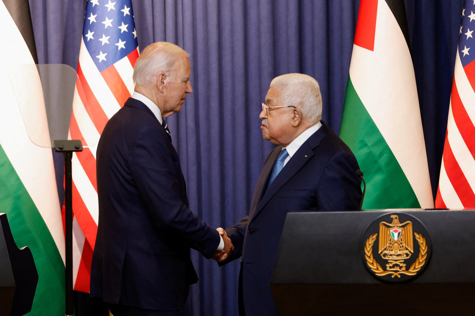 Biden shakes hands with Palestinian President Mahmoud Abbas during their meeting in the occupied West Bank.