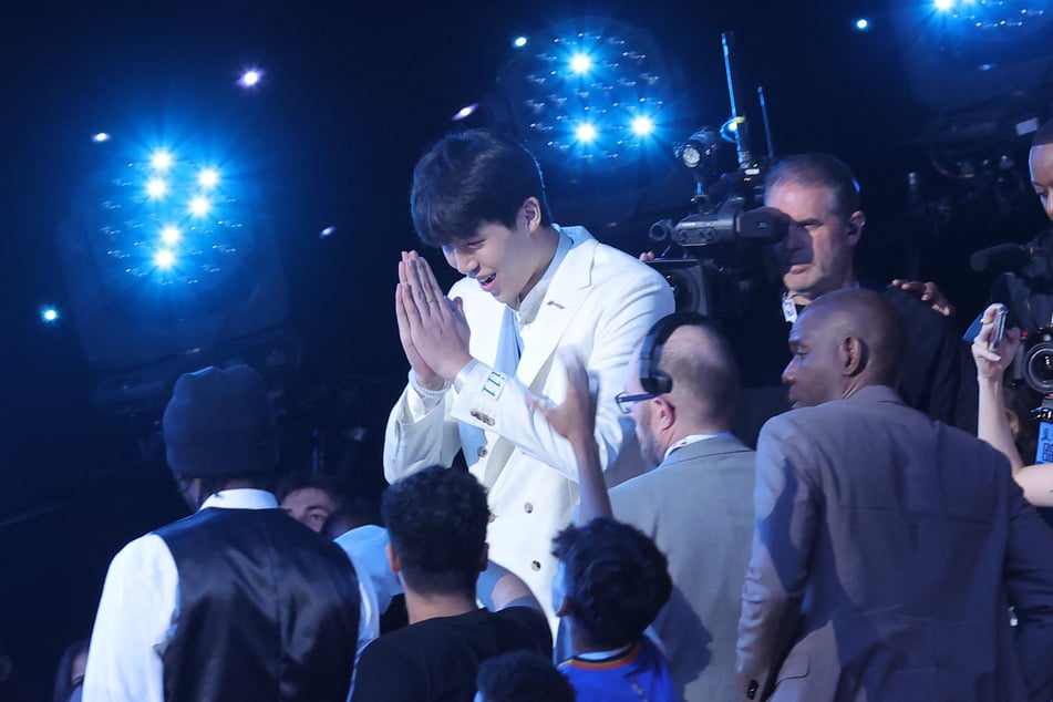Yang Hansen reacts after being selected as the 16th pick in the first round of the 2025 NBA Draft.